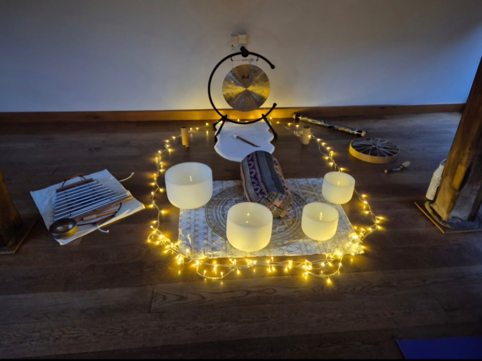 Gong, crystal singing bowls, chimes and other instruments prepared for a sound bath